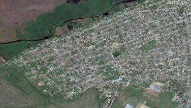 A satellite image shows the town of Oleshky