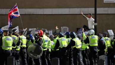 Anti-racism protesters gather to counter anti-immigration rally led by Tommy Robinson, in London