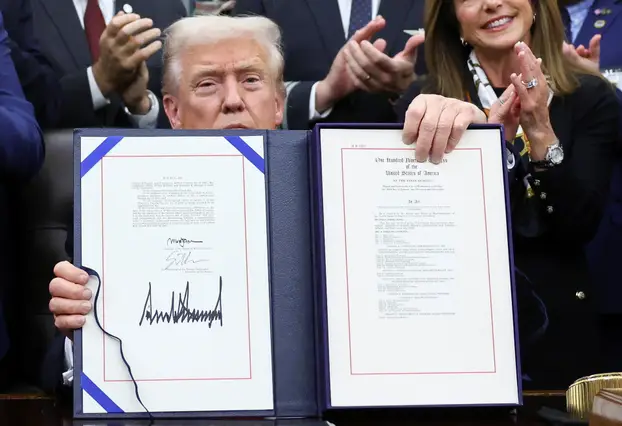 U.S. President Trump signs the funding bill to end the government shutdown, in Washington, D.C.