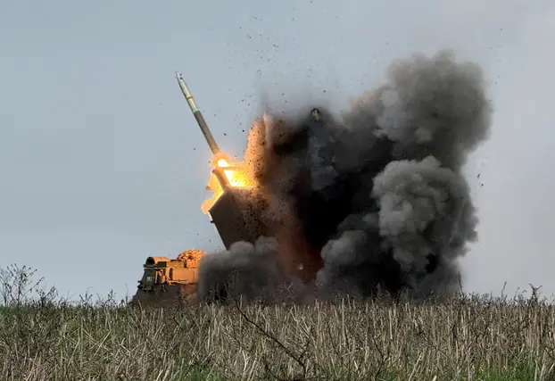 FILE PHOTO: Ukrainian servicemen fire a Multiple Launch Rocket System towards Russian troops near the frontline town of Pokrovsk