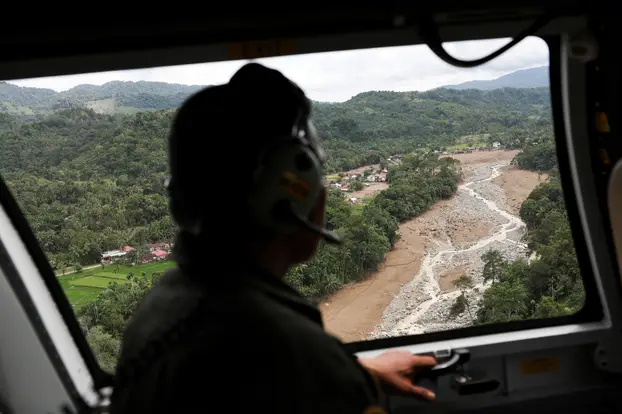 Relief supply packagaes distribution at an area hit by flash floods in Agam, West Sumatra