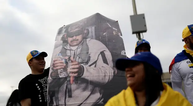 People celebrate following a U.S. strike on Venezuela where President Nicolas Maduro and his wife were captured, in Concepcion